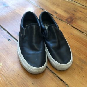 Black and gold leather slip on Vans